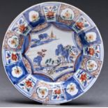 A Chinese Imari soup plate, 18th c, painted with a central landscape in panelled border, 23cm diam
