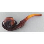 A Meerschaum tobacco pipe of eagle's claw and egg form, c1900, amber mouthpiece, plush cased