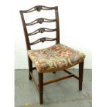A George III mahogany dining chair, c1780, with anthemion carved and pierced ladder back and