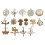 Miscellaneous British Army brass cap badges, including Royal Warwickshire and other regiments