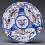 A Chinese Imari plate, 18th c, 22.5cm diam and another (2) The first riveted repair to crack and
