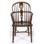 A Victorian yew wood Windsor chair, with crinoline stretcher and elm seat, seat height 43cm h One