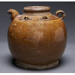 A South East Asian globular stoneware ewer, with four bow shaped shoulder handles, the rich brown