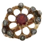 A garnet and topaz ring, in gold marked 18, 5.3g, size L Wear consistent with age