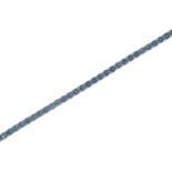 A blue topaz line bracelet, in 18ct white gold, 18cm l, maker F F, London 2000, 11g Good condition