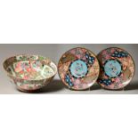 A pair of Japanese cloisonne enamel plates, decorated with a stylised dragon amidst clouds to the