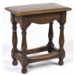 An oak joined stool, with ovolu moulded top and baluster legs, 47cm h; 27 x 45cm A good quality