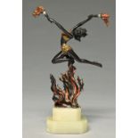 An art deco cold painted and patinated bronze statuette of a flame dancer, c1930, on stepped onyx
