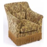 An Edwardian mahogany  chair, reupholstered in boteh decorated fabric, fringed, square tapered