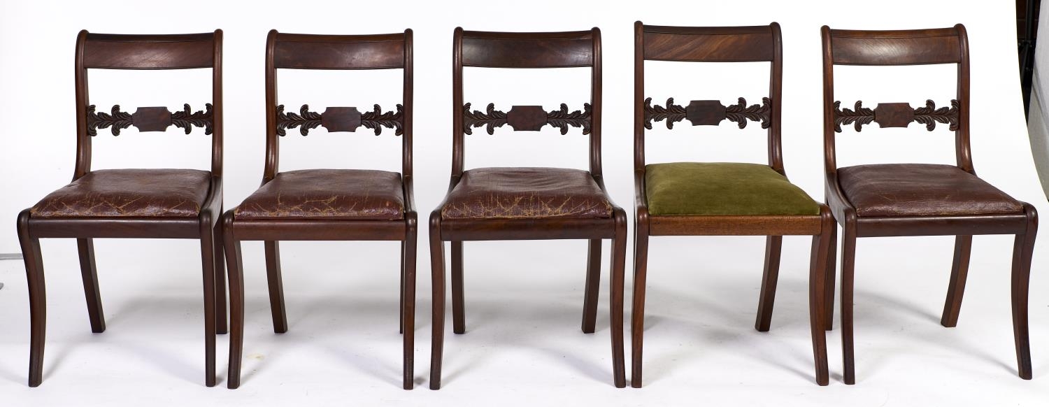 A set of five Victorian mahogany dining chairs, with tablet centred and leaf carved centre rail,