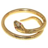 A 9ct gold serpent bracelet with ruby eyes, approximately 63mm, maker C & F (incuse), Chester 1960