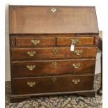 A George III oak bureau, with fitted interior, brass escutcheons and handles, 108cm h; 47 x 98cm Two