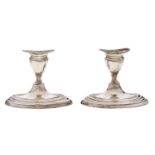 A pair of Edwardian silver dwarf navette shaped candlesticks, nozzles, 85mm h, by Thomas Bradbury &