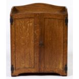 An Edwardian oak wall or table top stationery cabinet, with shaped three quarter gallery, pair of