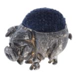 An Elizabeth II silver pig novelty pin cushion, 25mm h, maker's mark poorly struck, London 1993 Good