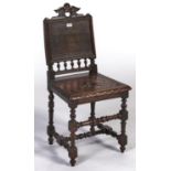 A Victorian oak Jacobean revival hall chair, c1870, the rectangular panelled back with pierced