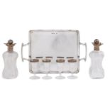 Hukin & Heath. A Victorian silver liqueur set, comprising pair of silver mounted threaded glass