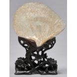 A Chinese export mother of pearl shell carving, 19th c, with a procession winding through a