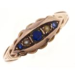 A synthetic sapphire and split pearl ring, in 9ct gold, Birmingham 1915, 2.4g, size O Wear
