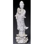 A Chinese blanc de chine figure of Guanyin, 35cm h Hole to accommodate left hand now lacking, the