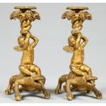Two French ormolu boy on a crocodile candlesticks, late 19th c,  beaded nozzles, 23cm h Good