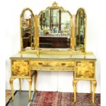 A jappaned dressing table, c1930's, the top with bow centre, decorated with figures and fishermen in