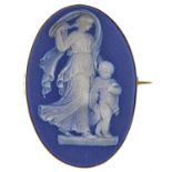 A Wedgwood dark blue jasper dip cameo brooch, late 19th c, in gold, impressed mark and marked 9ct,