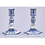 A pair of Meissen hexagonal blue and white Onion pattern candlesticks, 20th c, 13cm h, crossed