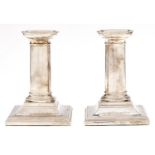 A pair of Victorian silver dwarf columnar candlesticks, nozzles, 10.5cm h, by Horace Woodward & Co