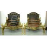 A pair of brass and burnished steel serpentine basket grates, 20th c, in neo classical style, urn