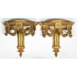 A pair of giltwood and composition wall brackets, c1900, in Louis XVI style, the breakarched shelf
