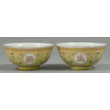 Two Chinese yellow ground porcelain bowls, with rounded sides and slightly everted rim, gilt with