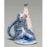 A Dutch Delftware monkey figural candle extinguisher, 19th c, painted with a landscape, 70mm h