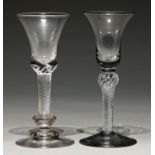 Two English wine glasses, the bell bowl on multi series air twist stem with shoulder knop or biconic
