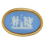 A Wedgwood jasper ware cameo brooch, late 19th c, sprigged with a group of four putti at an altar,