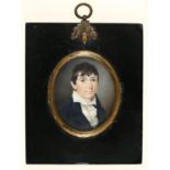 British School, early 19th c - Portrait Miniature of a Boy, in navy coat, open collar and frilled