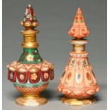Two French or Bohemian porcelain scent bottles and stoppers, c1840,  one painted with jewels on an