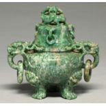 A Chinese mottled green stone tripod vessel and cover, 20th c, with loose rings, 15.5cm h Good