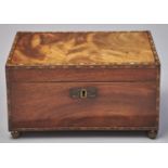 A George IV mahogany tea chest, c1825, with chevron bands, stamped brass escutcheon and ball feet,
