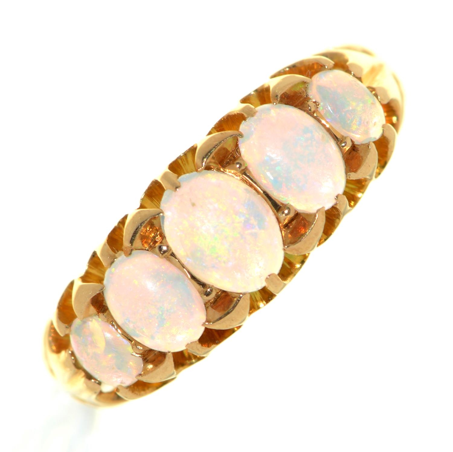 An opal ring, early 20th c, in 18ct gold, marks rubbed, 2.7g, size K Opals lacking polish from wear,
