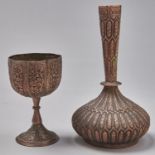 An Indian chased brass bottle and goblet, 19th c, partly tinned, bottle 23cm h Natural accretion
