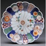 A Japanese Imari kiku moulded dish, Edo period, 18th / 19th c, 27cm diam, Wanli mark Small chip on