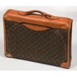 Vintage Luggage. A Louis Vuitton zipped bag, stitched tan leather trim and handle, 48cm l, maker's