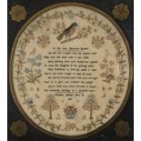 A George III oval Linen sampler, Christian Shittler, May 21 1819, worked with a bird on a bough,