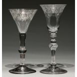 A 'Newcastle' light bluster wine glass, c1750, the bell bowl engraved with flowers and foliage,