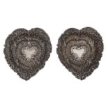 A pair of Victorian heart shaped and die stamped silver bon bon dishes, 90mm l, by W Comyns & Sons