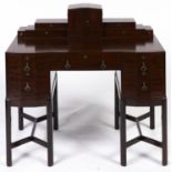 A Heal & Son mahogany writing table, 1931, stepped super structure fitted with drawers and centred