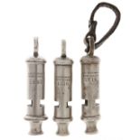 Three J Hudson & Co nickel whistles, dated 1915, 1916 and 1935