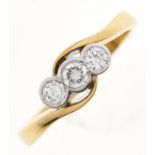 A three stone diamond crossover ring, in 18ct gold, 2.9g, size K½ Good condition