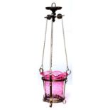 An Edwardian brass hall lantern and a cranberry glass shade, 26cm h, suspended by three chains